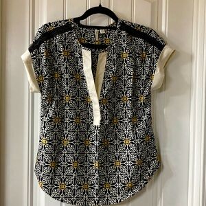 XS blouse with beaded detail on shoulder.